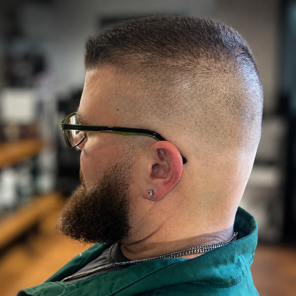 Finished men’s fade with a naturally blended sideburn and detailed beard